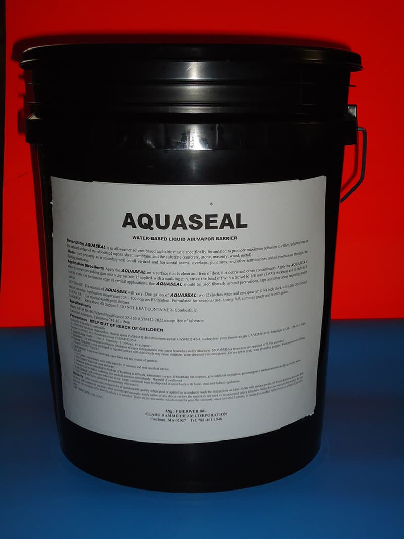 A black bucket of water with the label " aquaseal ".